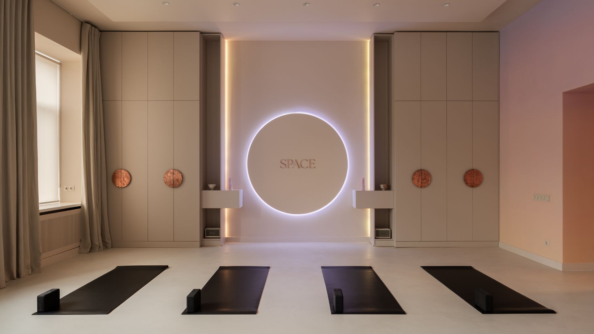 Yoga practitioner seated comfortably on a mat in a calm room ready for a beginner-friendly session