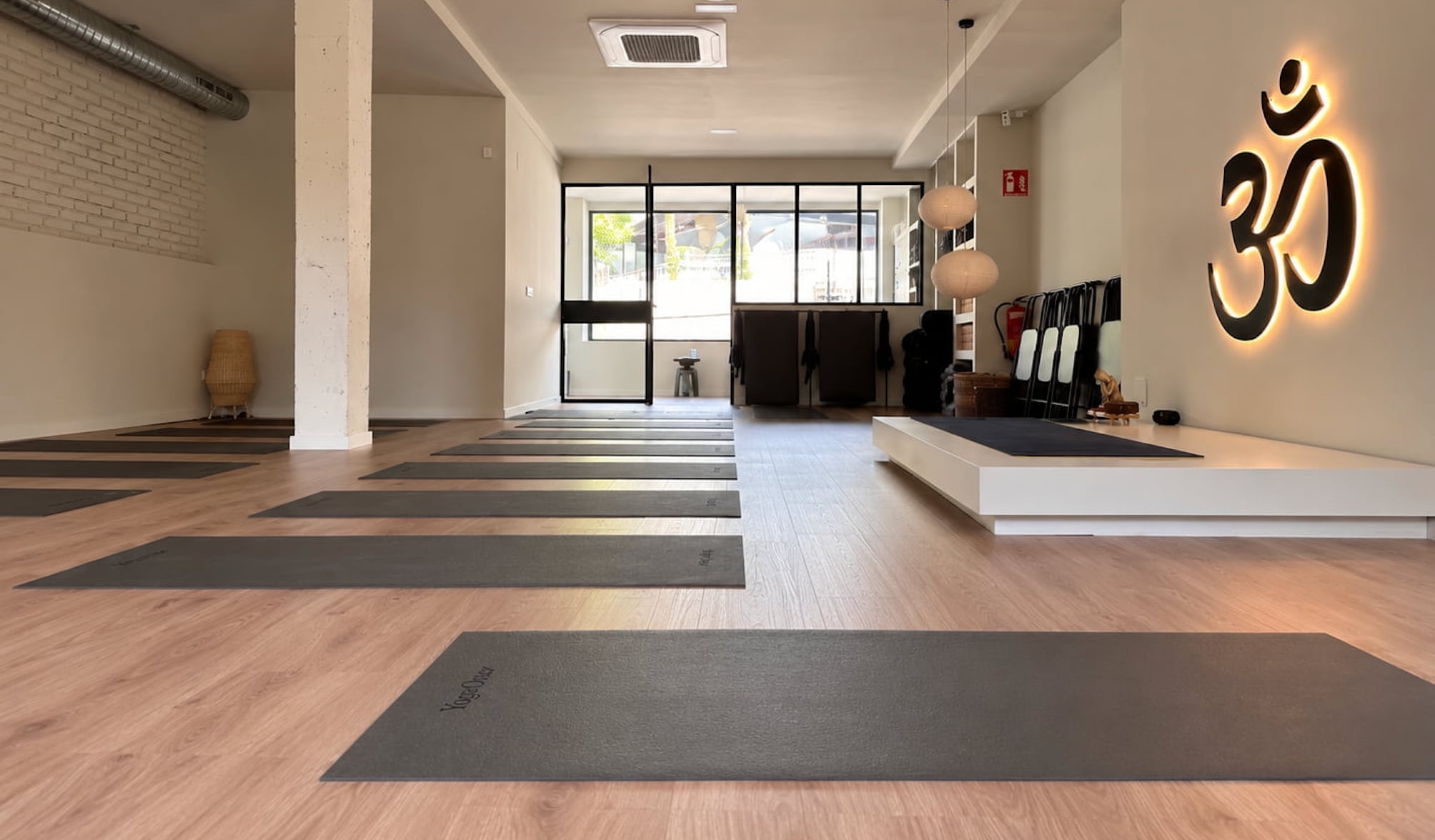 Peaceful yoga studio with comfortable mats and a softly lit practice area designed for mindful movement and relaxation