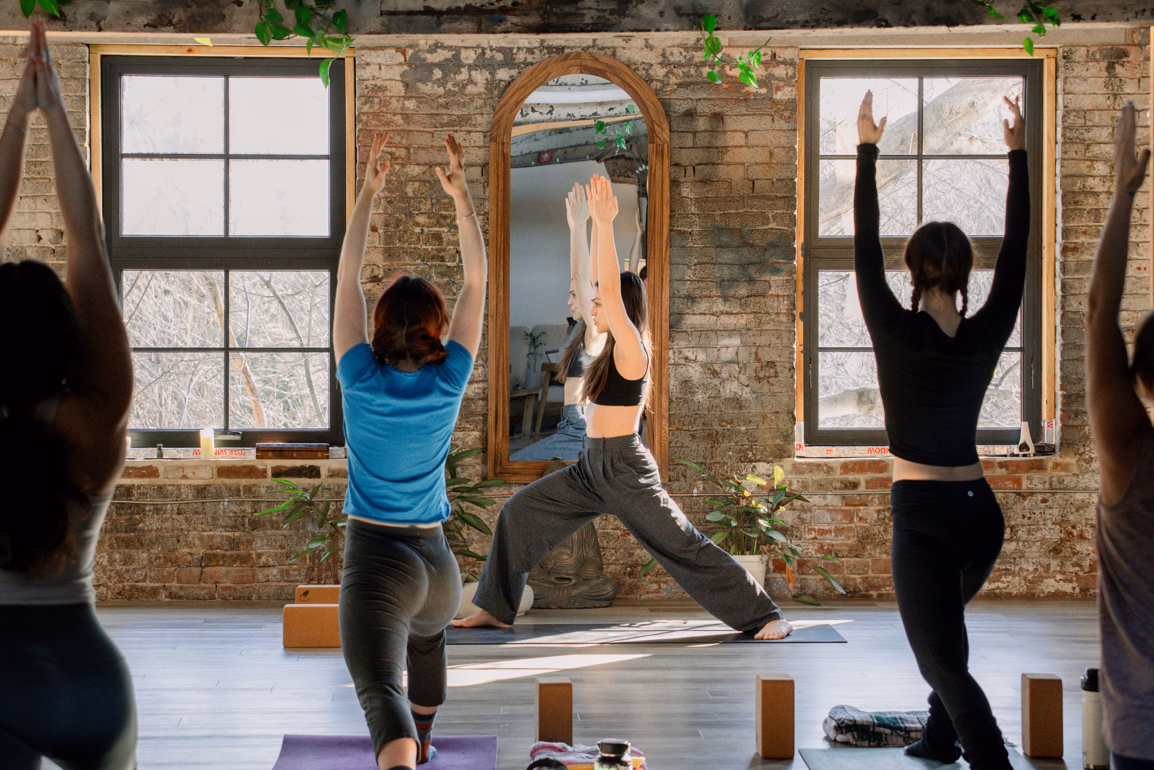 Yoga instructor demonstrating a grounded standing posture with careful attention to alignment and body awareness